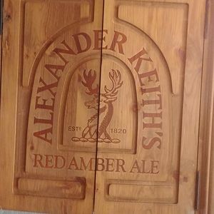 Dart board horse hair enclosed in wood.  Very nice good condition has been light